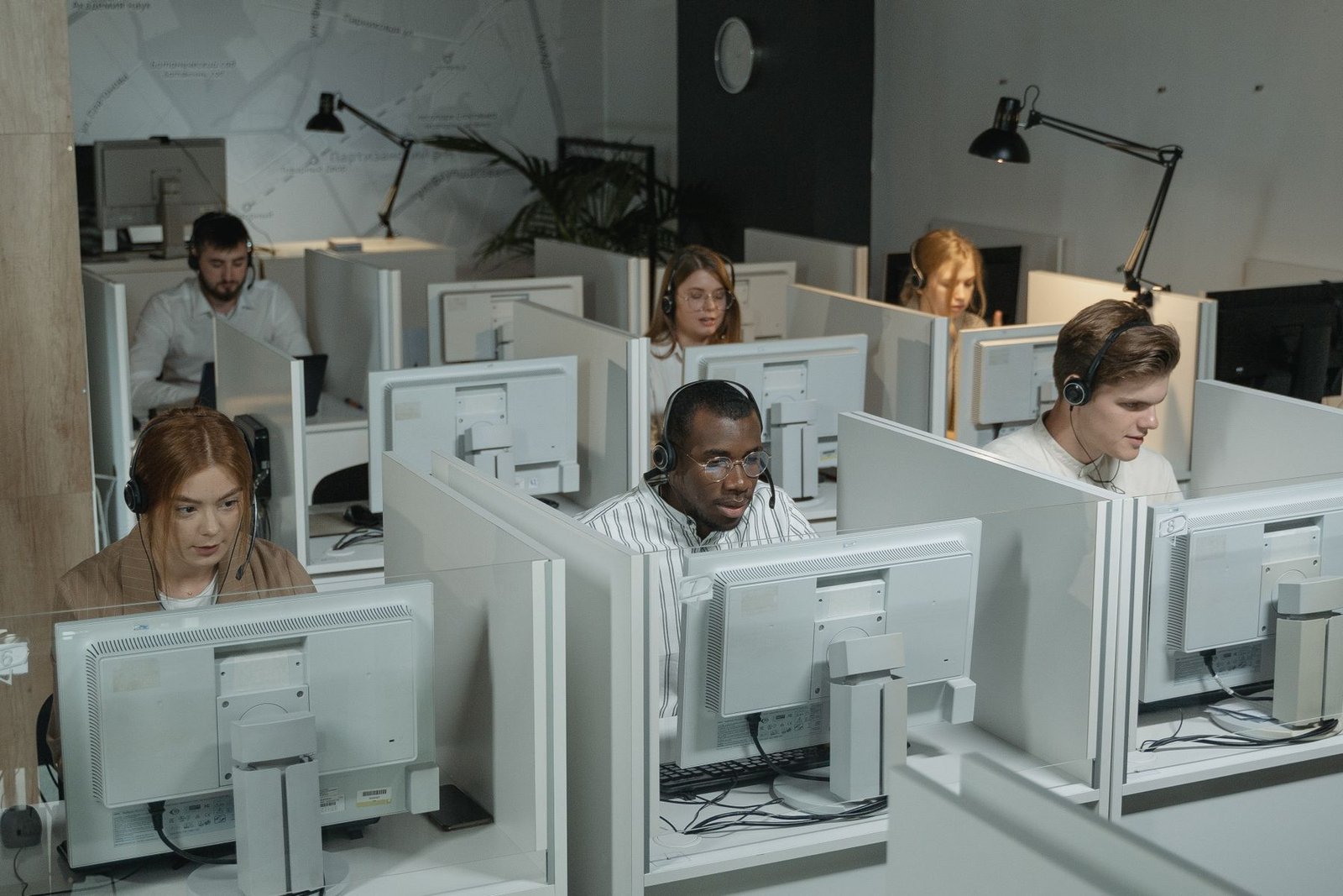 Professional customer support team working in a modern office