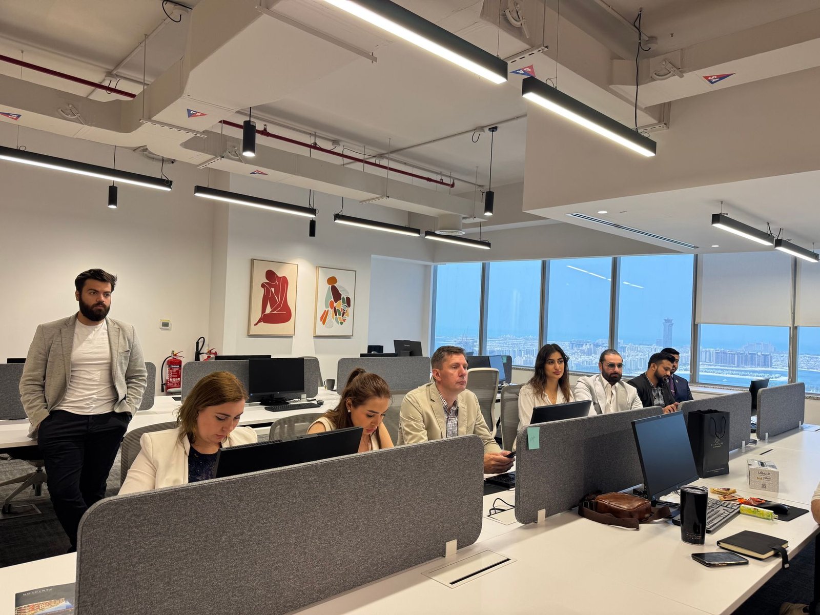 Diverse professionals collaborating in a modern Dubai office