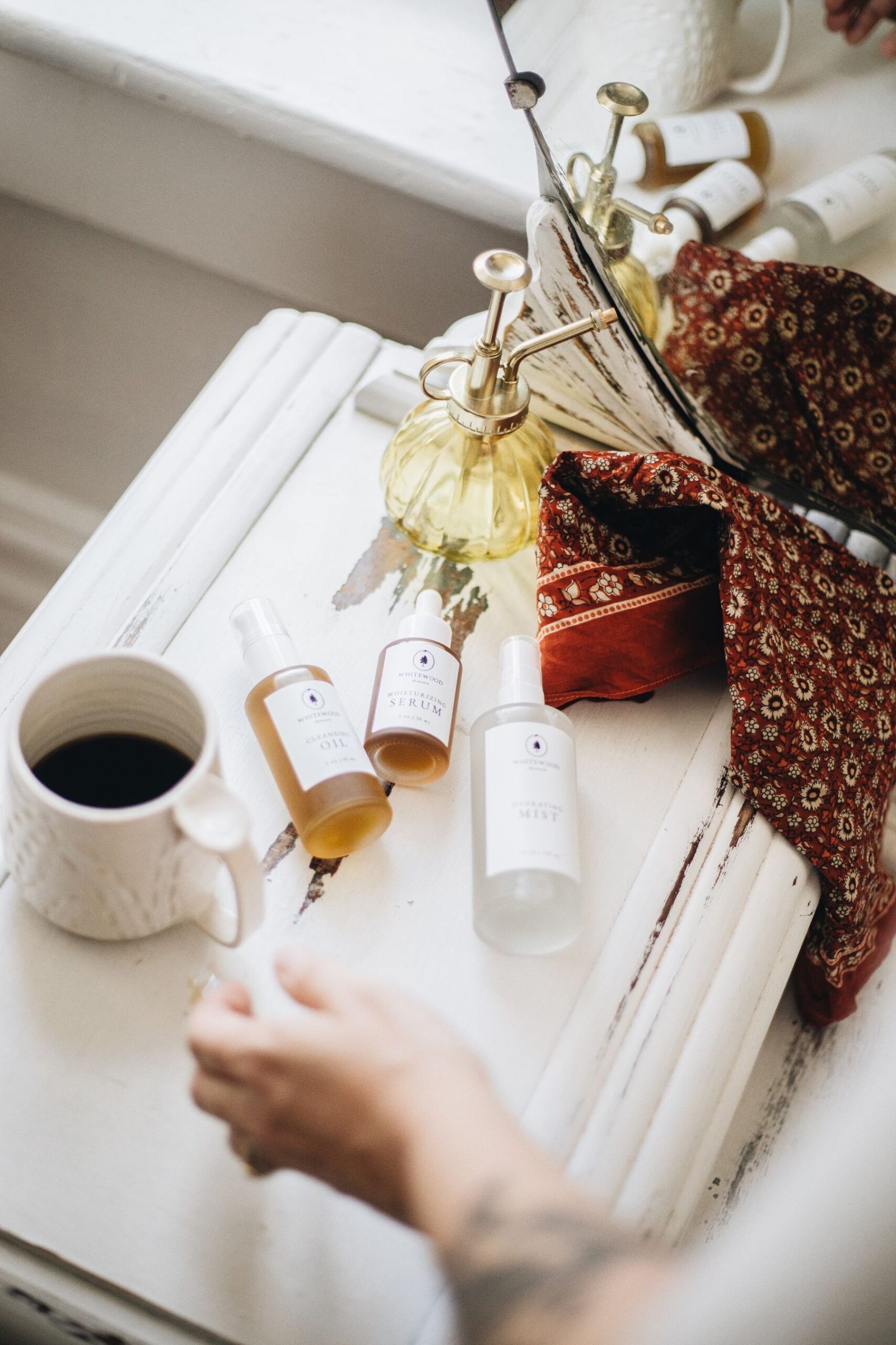 Premium natural skincare products arranged in a minimalist self-care setting