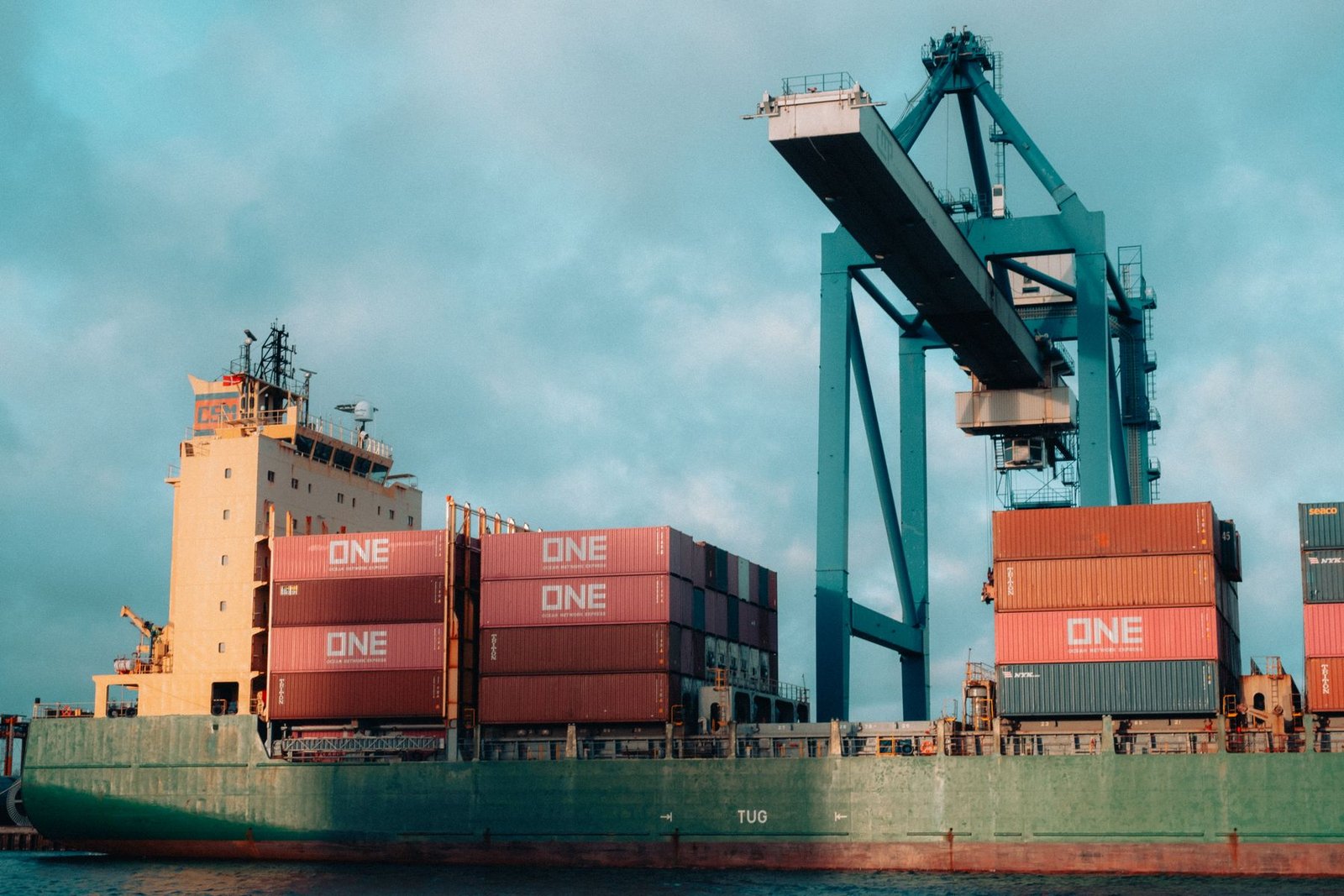 Container ship and port infrastructure representing global trade routes