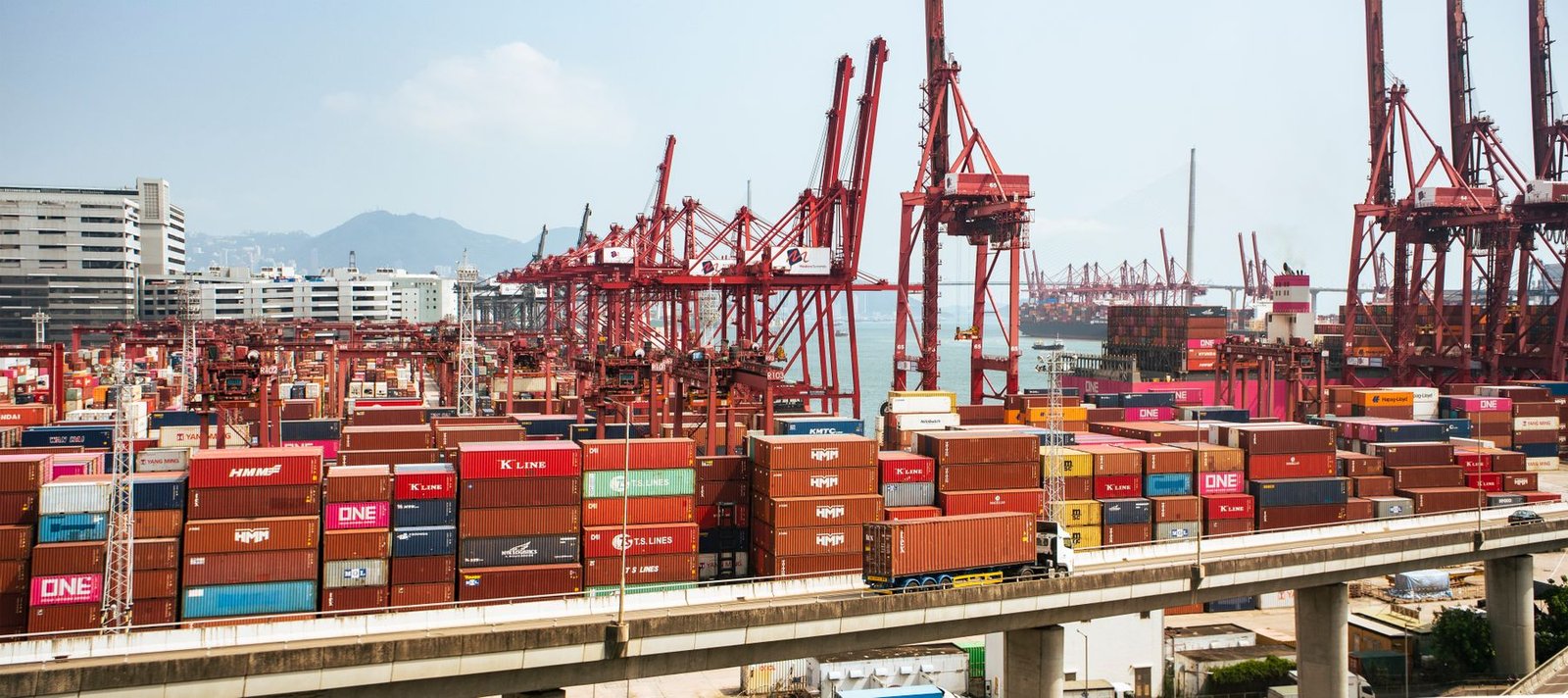 Cargo containers and cranes at a busy international port