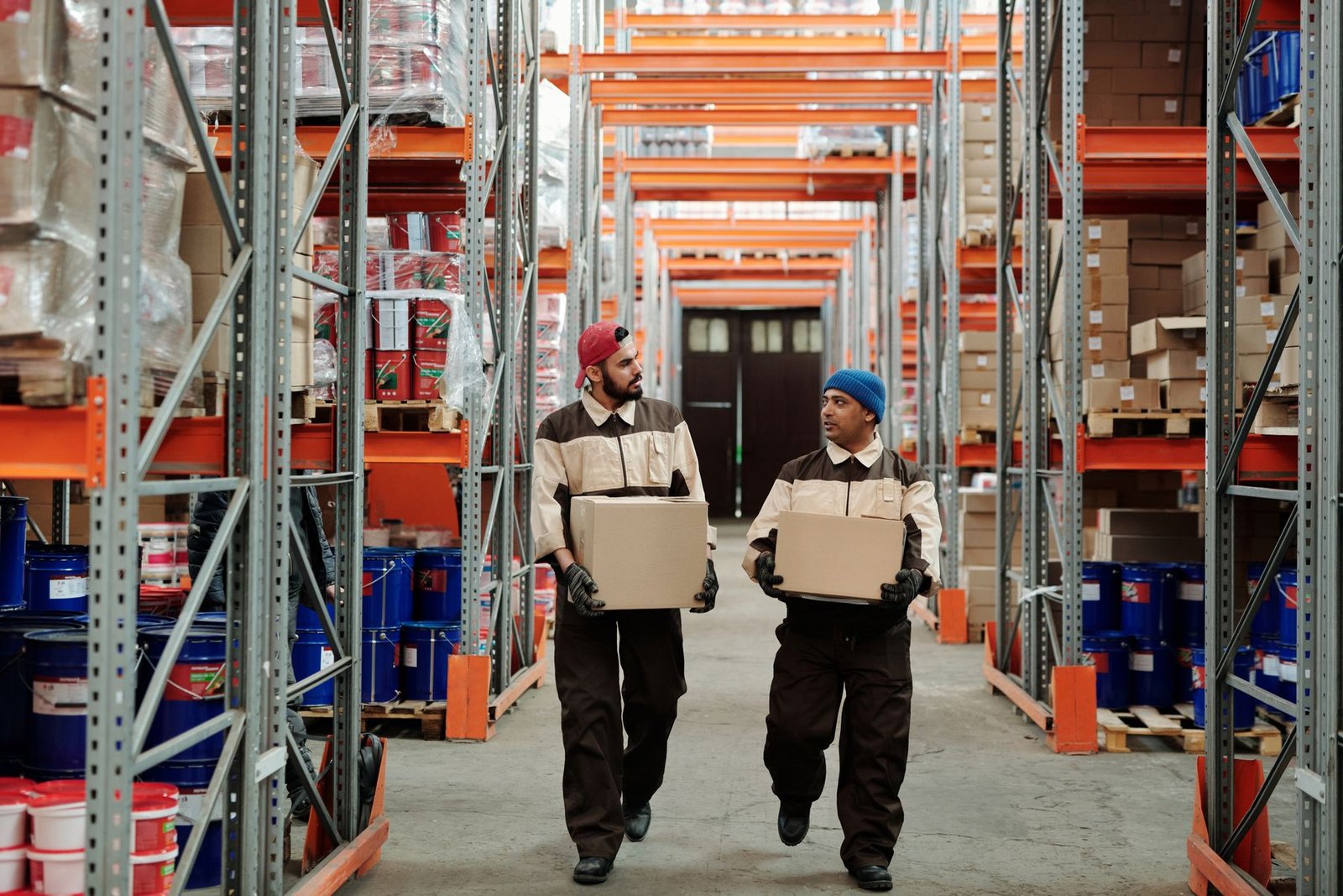 Warehouse workers moving goods through a distribution operation